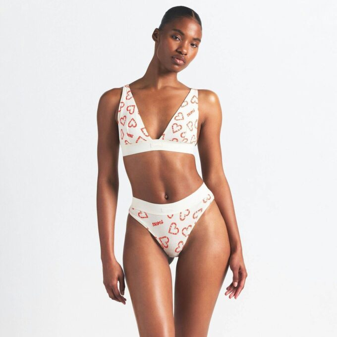 BOMULLSRIBBELT BRALETTE MED DYP UTSATT UTSEEND
